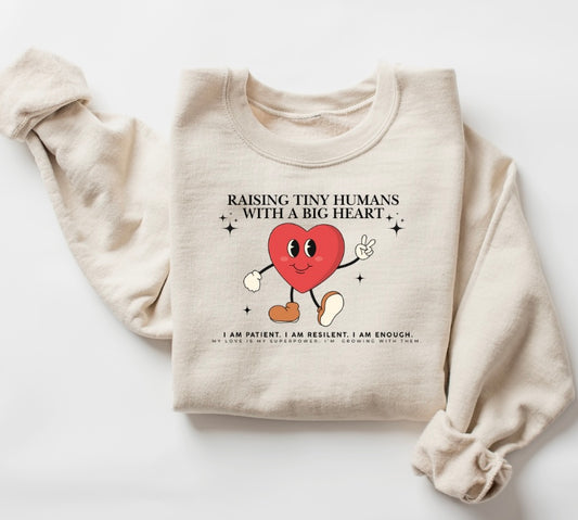 Raising Tiny Humans With a Big Heart Crewneck